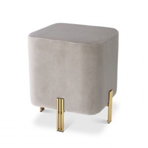 The cube-shaped Burnett Stool stands out by its peculiarly placed legs with a brushed brass finish.