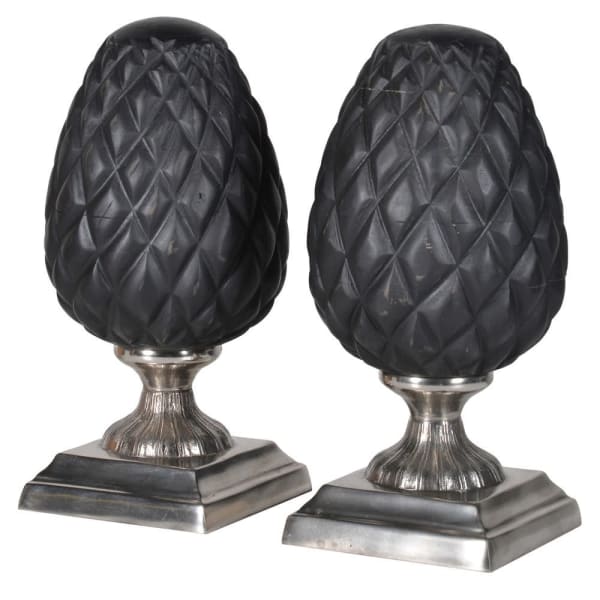 The Pair of Black Oval Decorations On Stands gives to your room the perfect touch