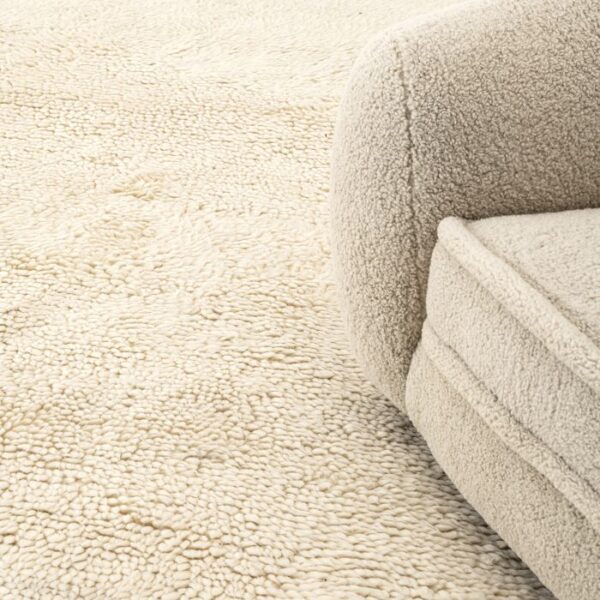 A8955D39-9C05-4260-AD4B-1188707B7BBA Hand tufted from 100% New Zealand wool pile, the solid white Carpet Oscar will be an inviting, textured addition to your living space or bedroom.